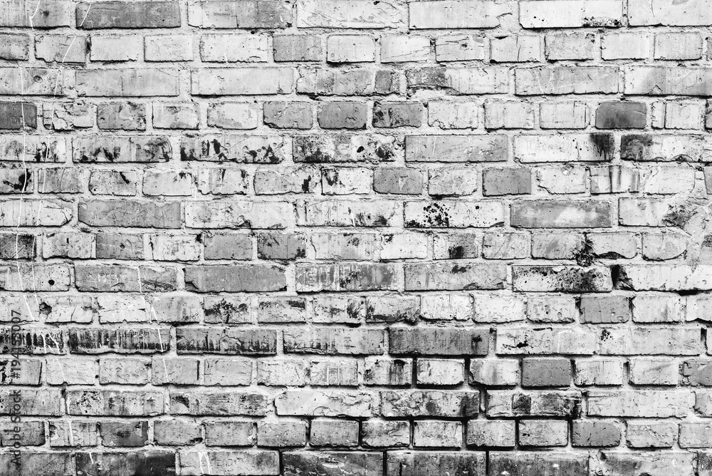 Fototapeta premium Brick texture with scratches and cracks