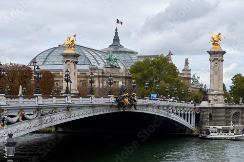 The Pont Alexandre III is a deck arch bridge that spans the Seine in Paris.