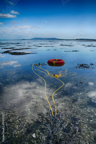  lifebuoy in blue water, A Stolen Ringbouy A Stolen life, Galway Ireland