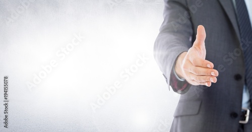 Handshake reach of businessman photo