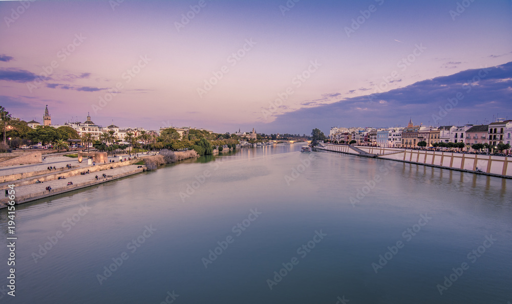 Blue Hour vew of seville and torre del oro from the triana bridge