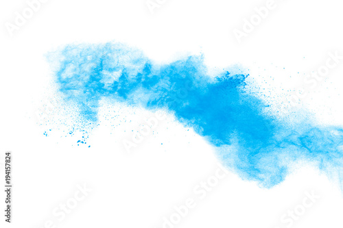 Freeze motion of blue dust explosion on black background. Throwing blue powder out of hand against black background. Stopping the movement of blue holi on the air use for abstract background.