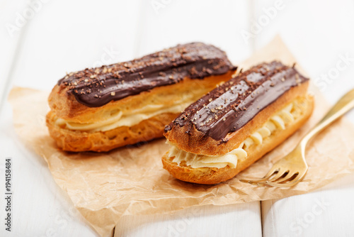 Traditional french eclairs with chocolate.