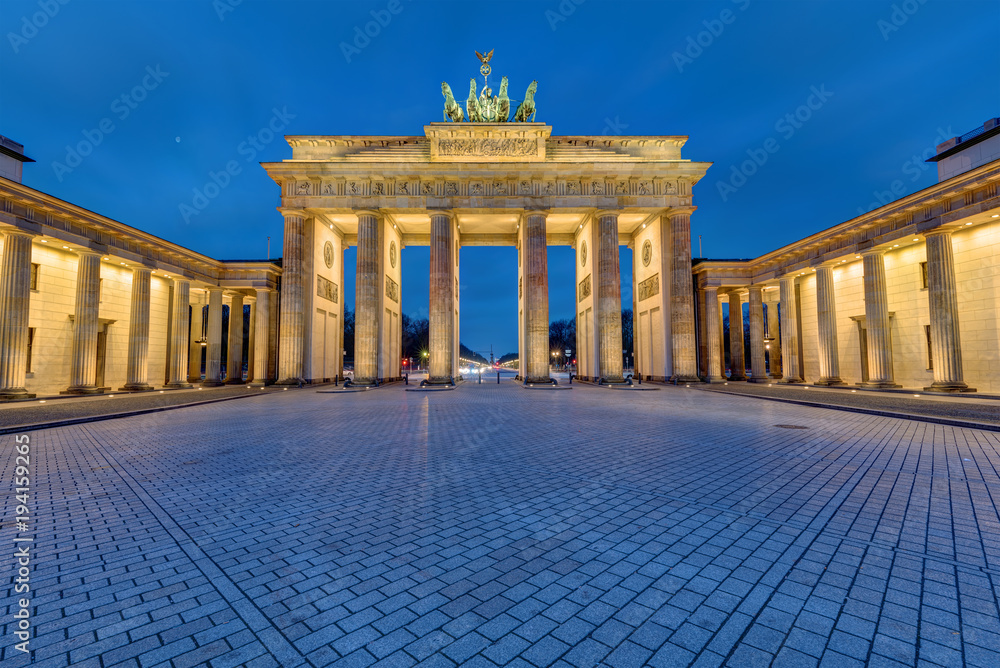 The famous Brandenburg Gate in Berlin illuminated in the early morning