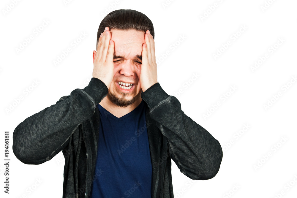 Worried bearded young man suffering from headache Worried bearded young man suffering from headache