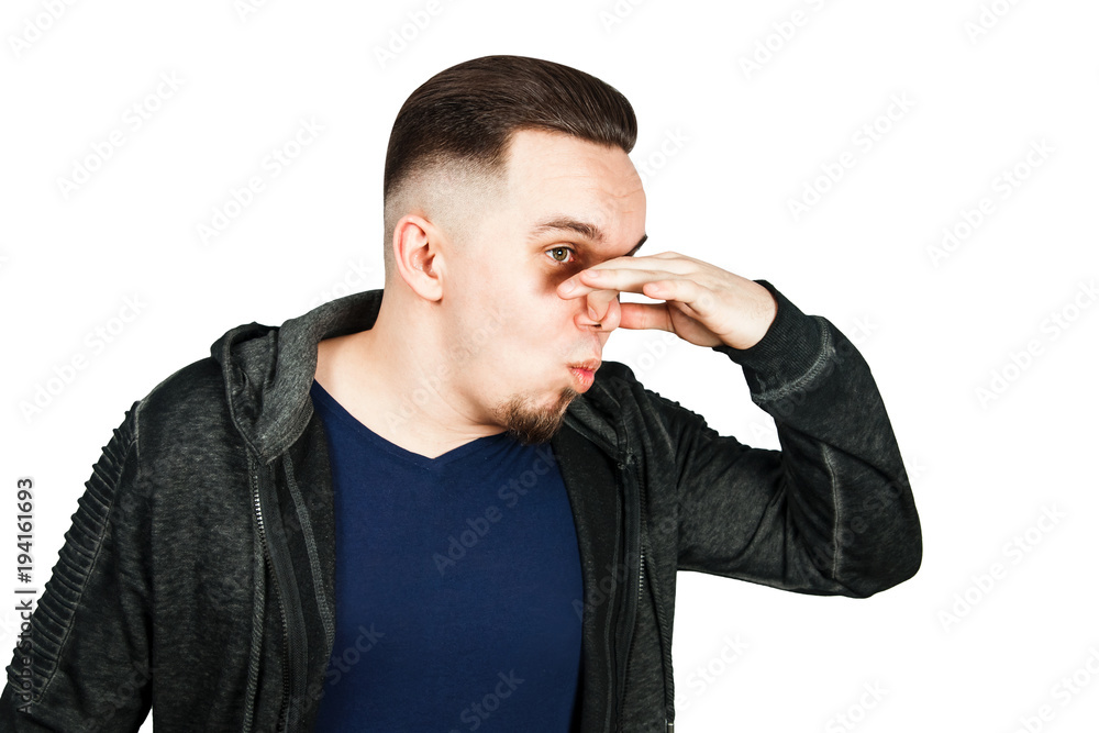 Closeup portrait of handsome guy, businessman closing nose, something stinks. Negative human face expressions, emotions, feelings, reaction, attitude, behavior, perception Closeup portrait of handsome guy, businessman closing nose, something stinks. Negative human face expressions, emotions, feelings, reaction, attitude, behavior, perception