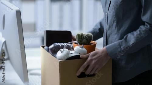 Fired employee packing and leaving the office