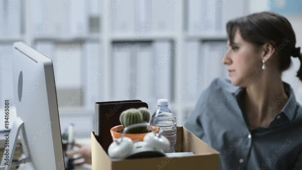 Fired employee packing and leaving the office Fired employee packing and leaving the office