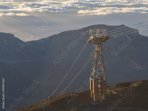pole pylon of cable car on top of pico del teide mountain in tenerife early morning light and clouds