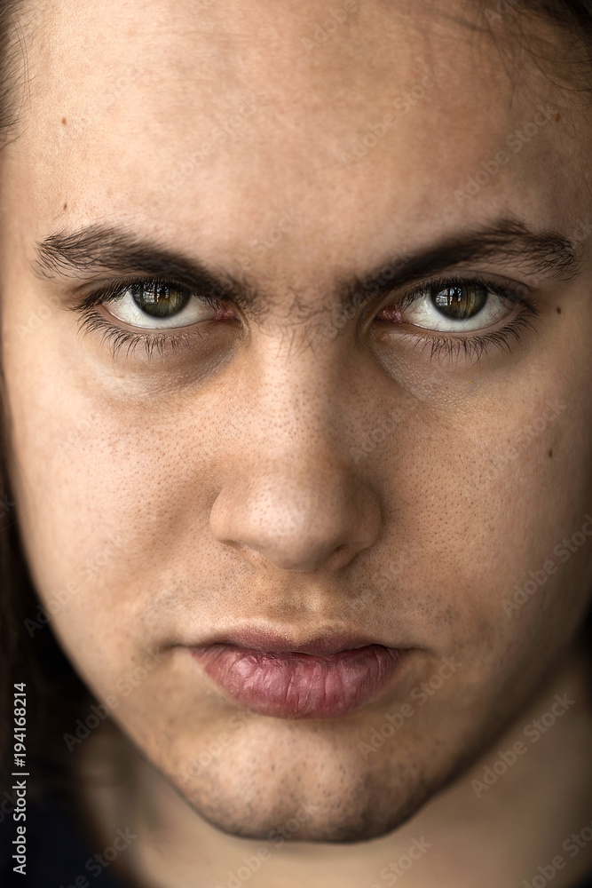 Face and eyes of a young handsome man with expressive eyes closeup Face and eyes of a young handsome man with expressive eyes closeup