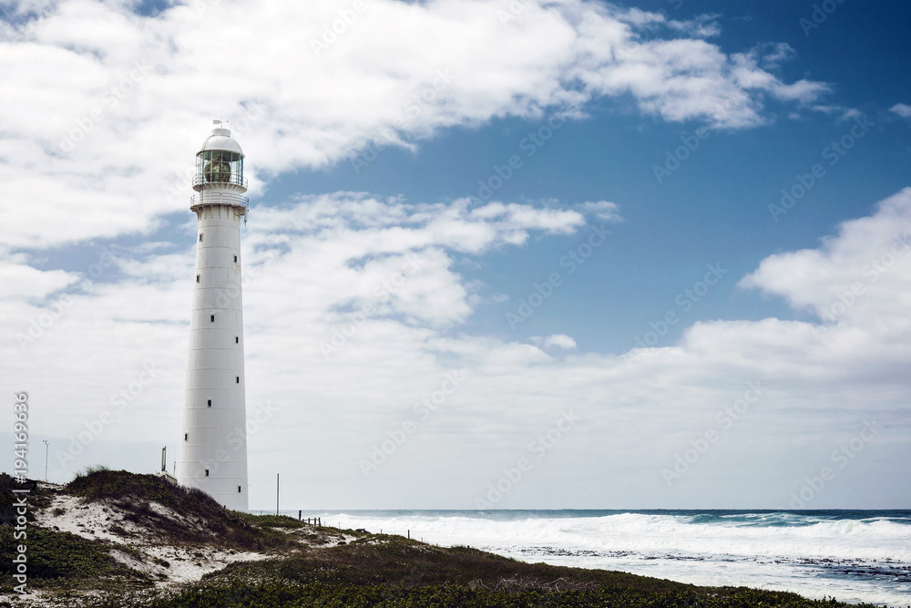 Lighthouse on a rugged coastline with a vintage look in Cape Town
