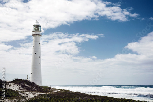 Lighthouse on a rugged coastline with a vintage look in Cape Town
