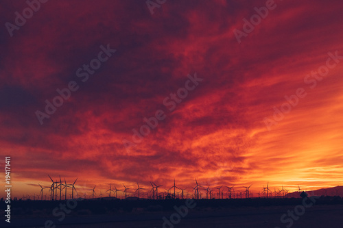 Sunset in the Desert with Wind Turbines
