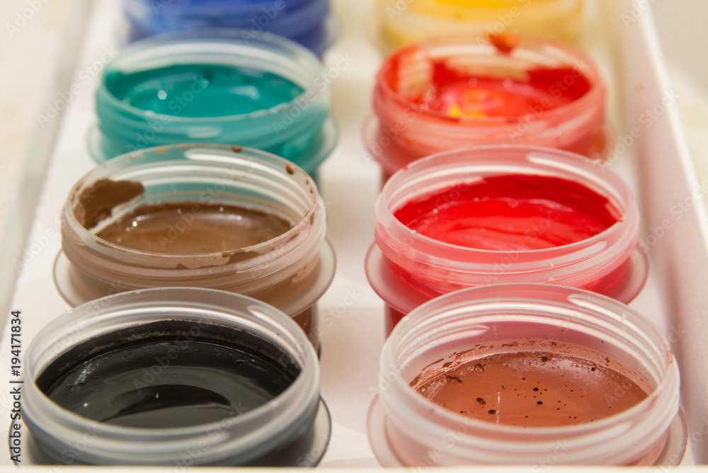 a set of gouache paints in different colors a set of gouache paints in different colors