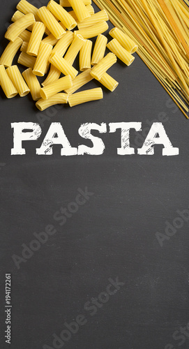 Background with pasta and copy space with the word Pasta over. Copy space. Conceptual.
