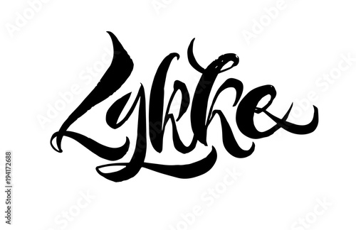 Lykke lettering. It is a Danish happiness concept. Hand drawn calligraphy inscription. Brush pen modern text. Black on white photo