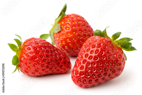 Three strawberries on a white