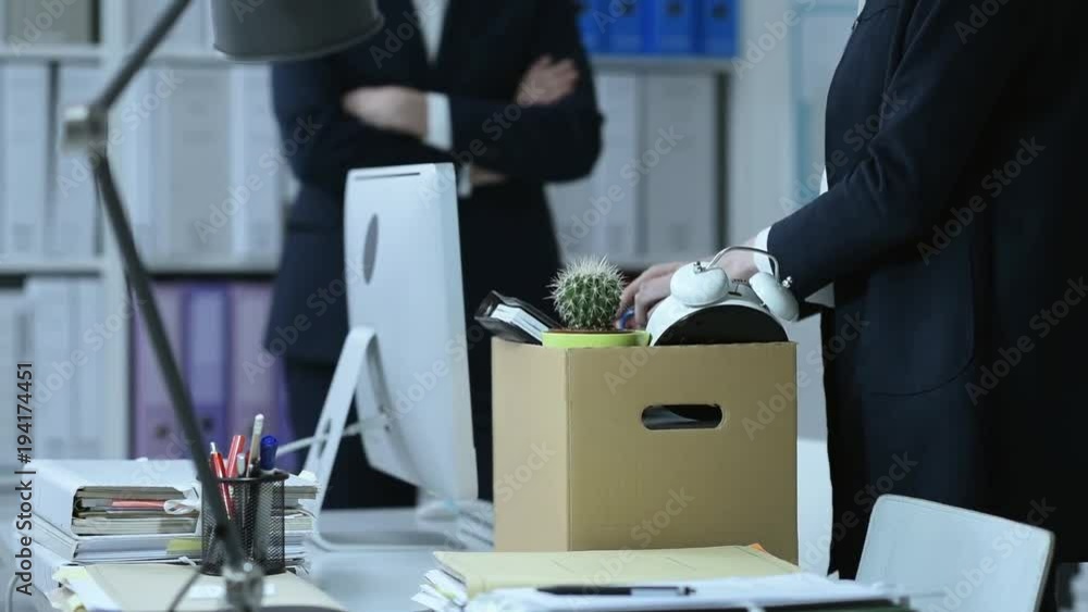 Fired employee packing her belongings Fired employee packing her belongings