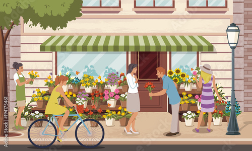 People in front of a colorful flower shop.
