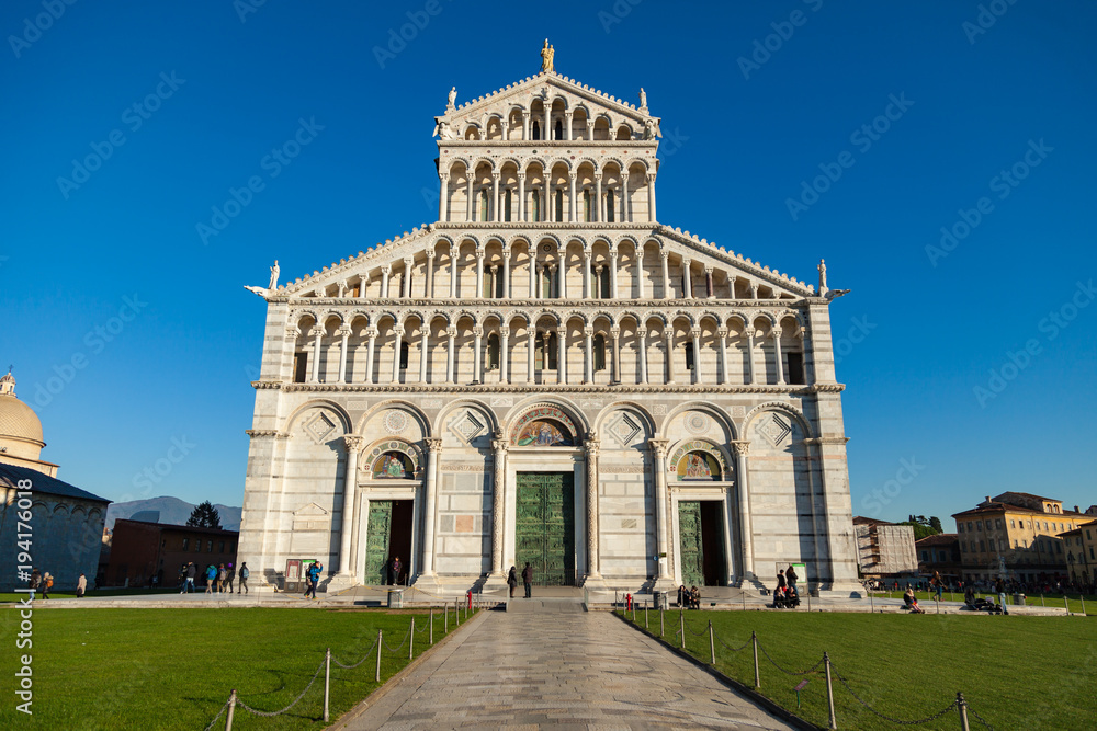 Facade of the cathedral (Duomo) in Pisa on blue background, Tuscany, Italy