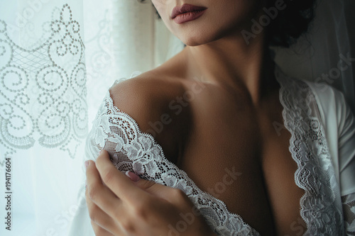 Portrait of seductive bride preparing to a wedding day photo