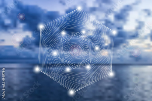 Abstract geometric symbol on blurred natural background.