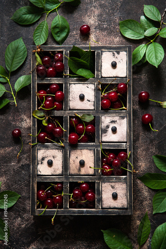 Fresh cherries in wooden box photo