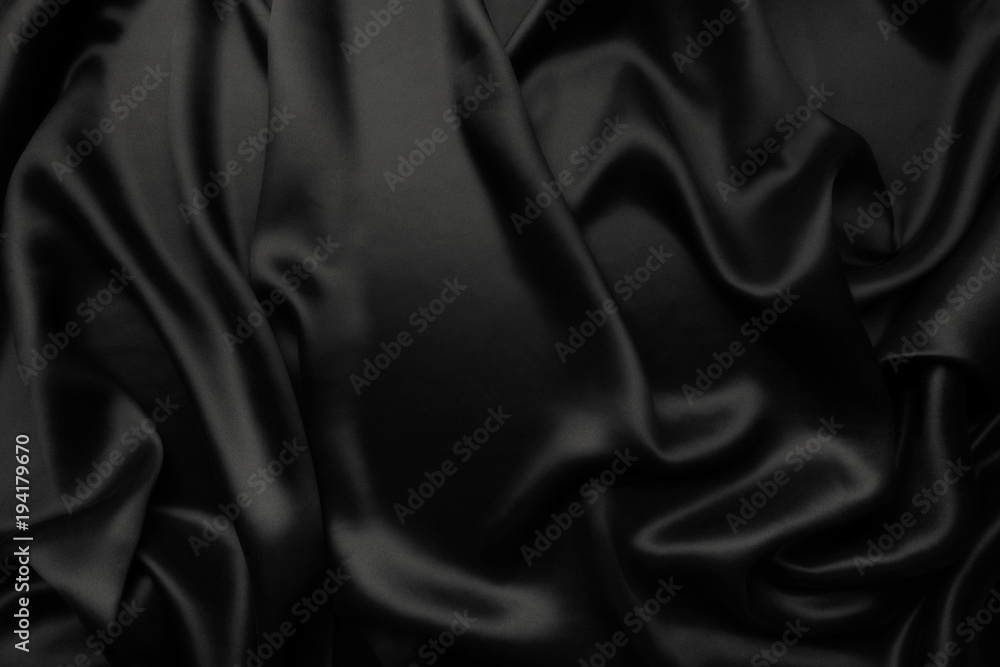 Fototapeta premium Elegant black satin silk with waves, abstract background