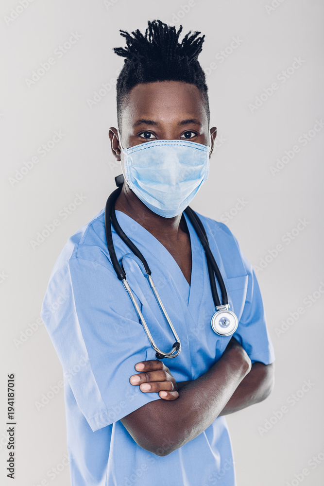 African-American doctor on a gray background African-American doctor on a gray background