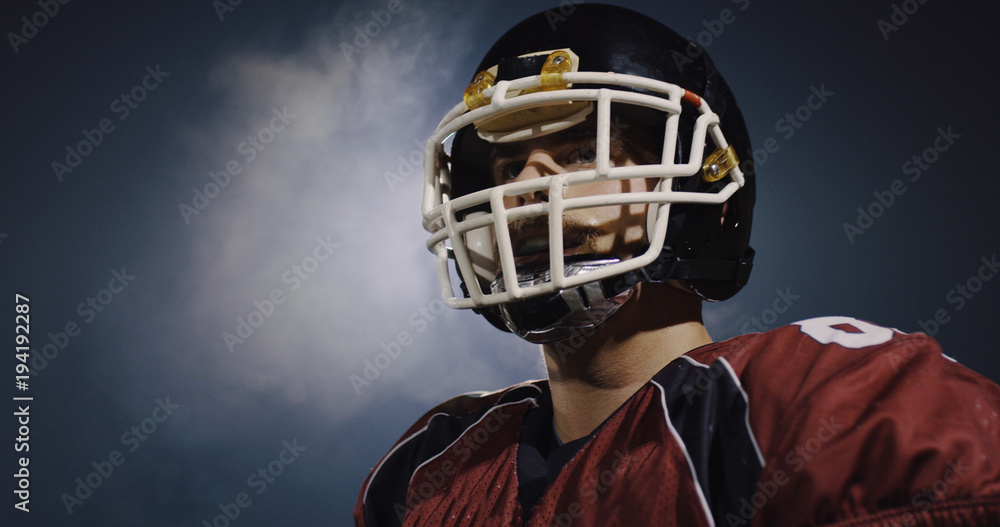 Naklejka premium portrait of young confident American football player