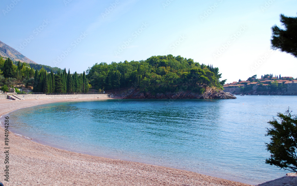Empty beach on sea cost seascape concept scene in Montenegro, Queen beach Sv. Stefan Milocer at Adriatic sea  