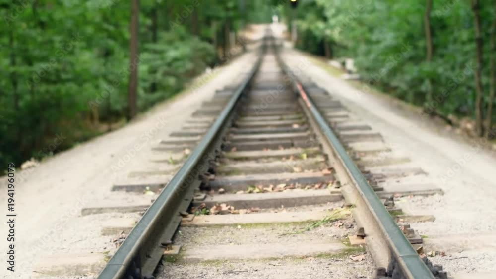 Full HD video background. Children's railway in the city's central park. Rails, soft focus, vertical panorama. Full HD video background. Children's railway in the city's central park. Rails, soft focus, vertical panorama.