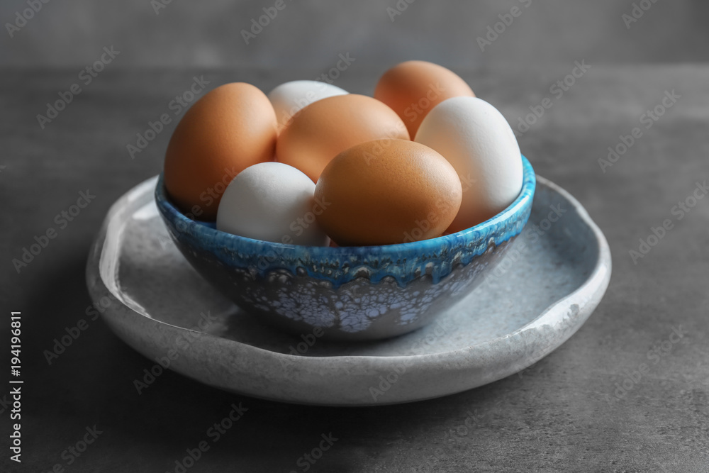 Plate with chicken eggs on table Plate with chicken eggs on table