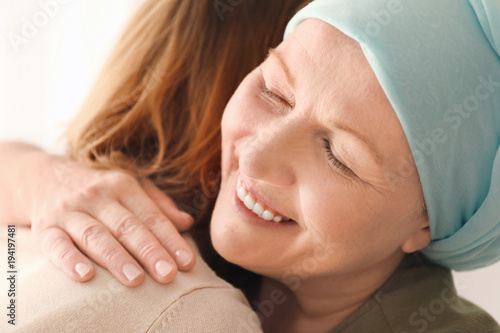 Woman hugging her mother wi...