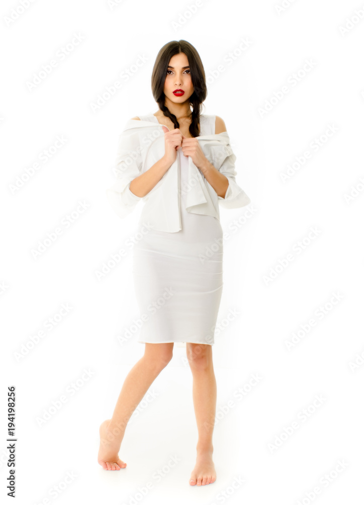 Young beautiful woman in white dress on white background, Girl with pigtails posing Young beautiful woman in white dress on white background, Girl with pigtails posing