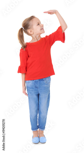 Little girl measuring heigh...