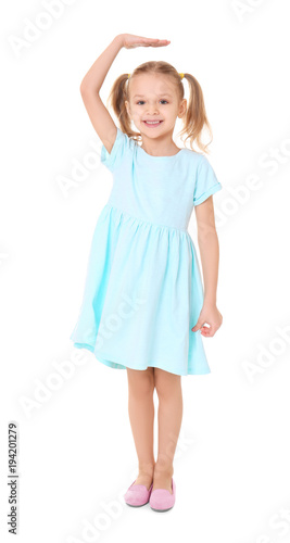 Little girl measuring heigh...