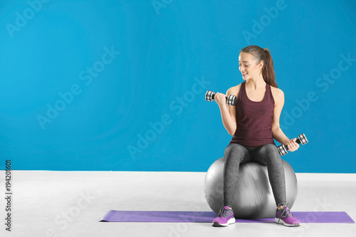 Beautiful young woman doing...