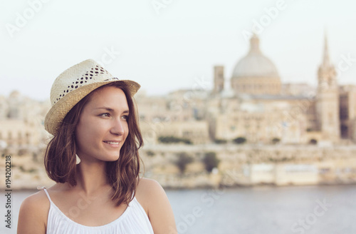 Young woman with hat summer portrait in Valletta, Malta