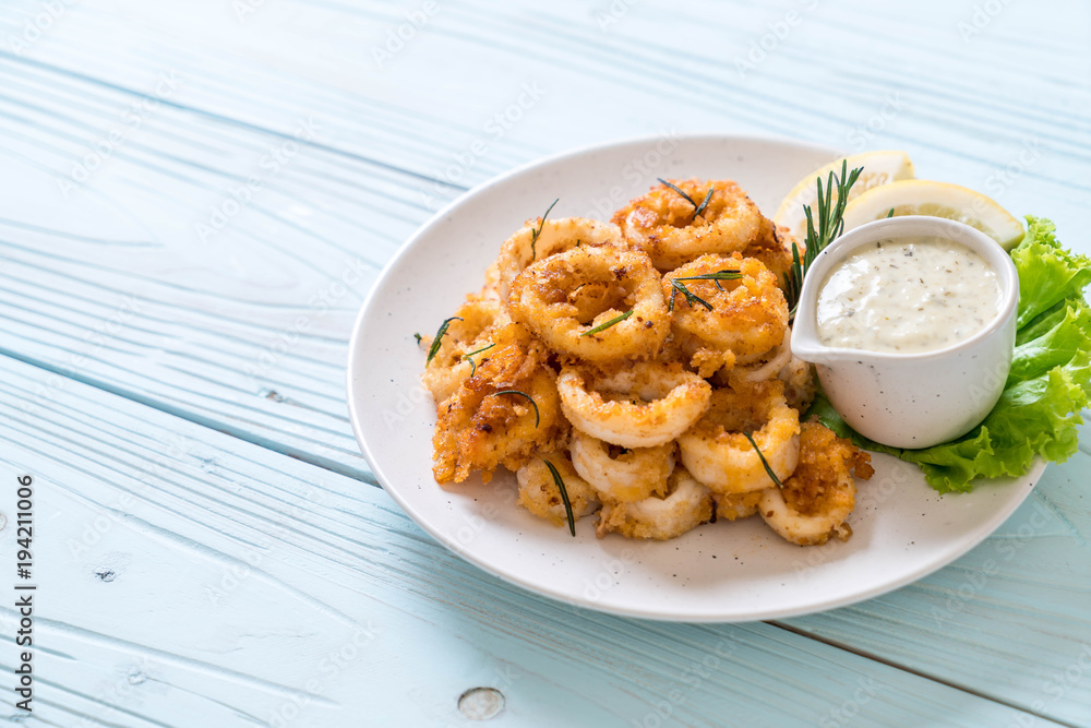 fried squids or octopus (calamari) with sauce fried squids or octopus (calamari) with sauce