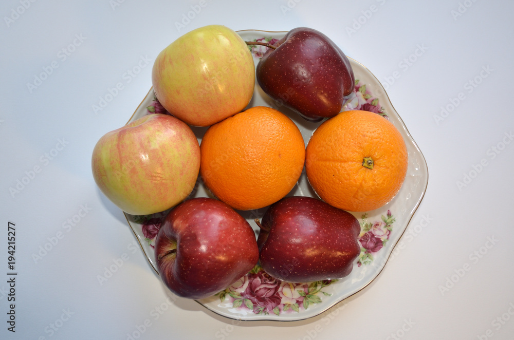 A dish of fruit. Ripe apples and oranges. even an image with these fruits causes salivation. they so ask, give up fast food and eat us A dish of fruit. Ripe apples and oranges. even an image with these fruits causes salivation. they so ask, give up fast food and eat us