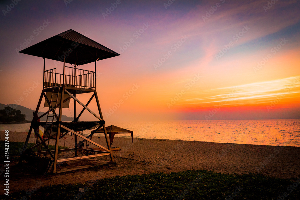 Lifeguard station over the seacoas with sunset on the beach, Evening time Lifeguard station over the seacoas with sunset on the beach, Evening time