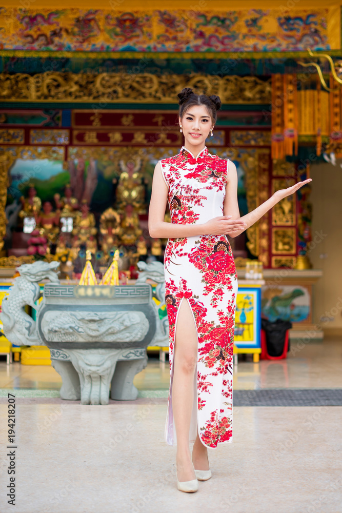 groentje Grommen liefde Asian woman wearing chinese dress, smile in chinese new year, Chinese woman  dress traditional cheongsam at Chinese Temple. Stock Photo | Adobe Stock