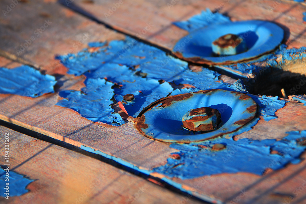 Naklejka premium Old Blue Paint and Rusty Bolts Texture