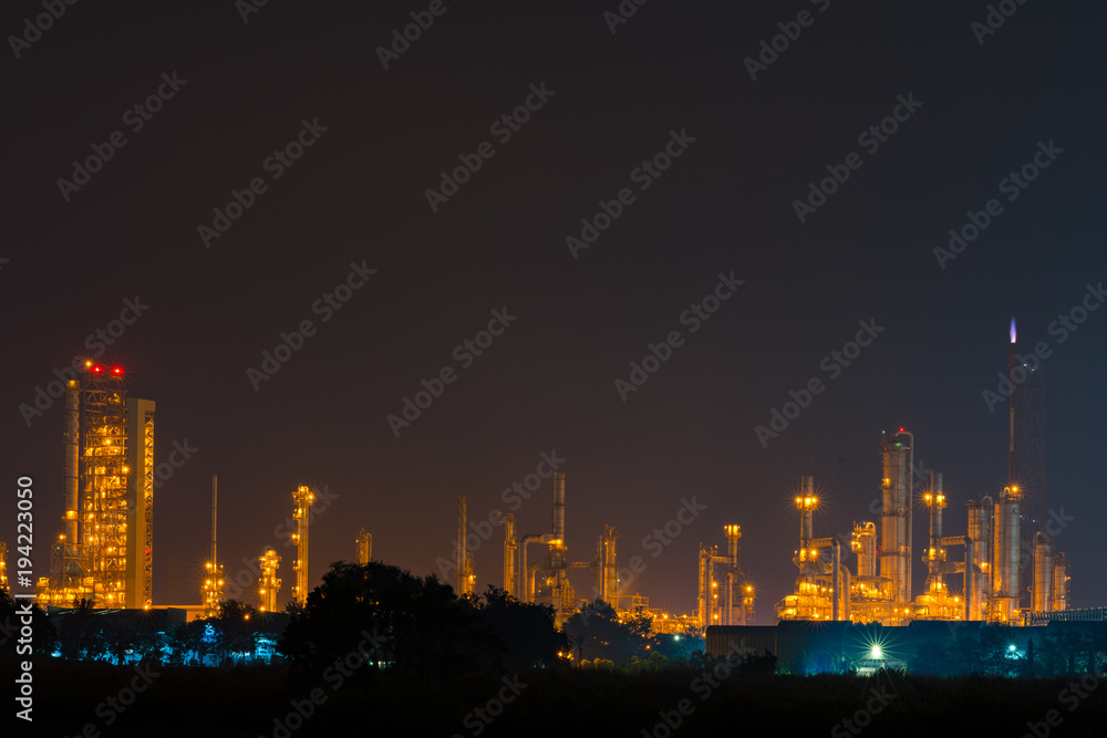 Night view over petroleum power plant industrial background
