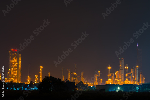 Night view over petroleum power plant industrial background