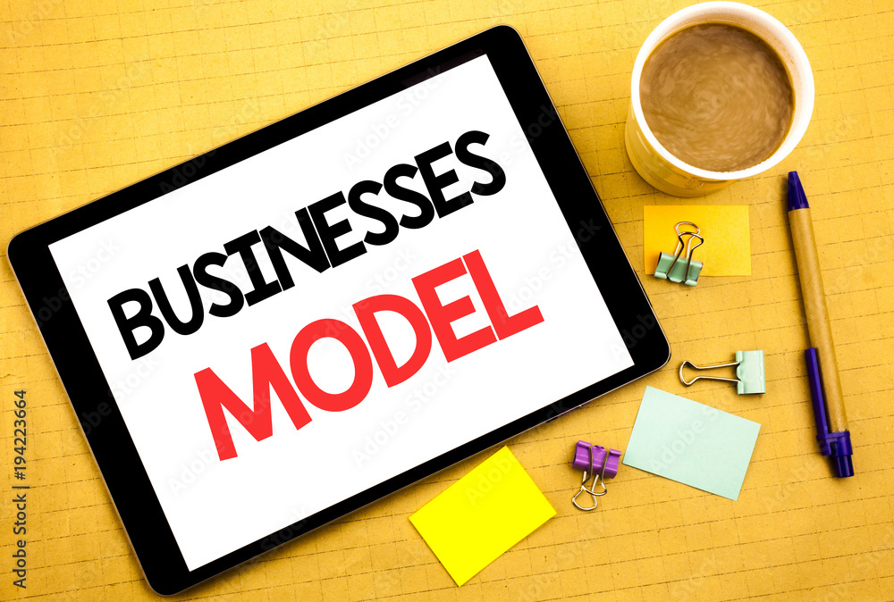 Conceptual hand writing text caption showing Businesses Model. Business concept for Project For Business Written on tablet laptop, wooden background with sticky note, coffee and pen