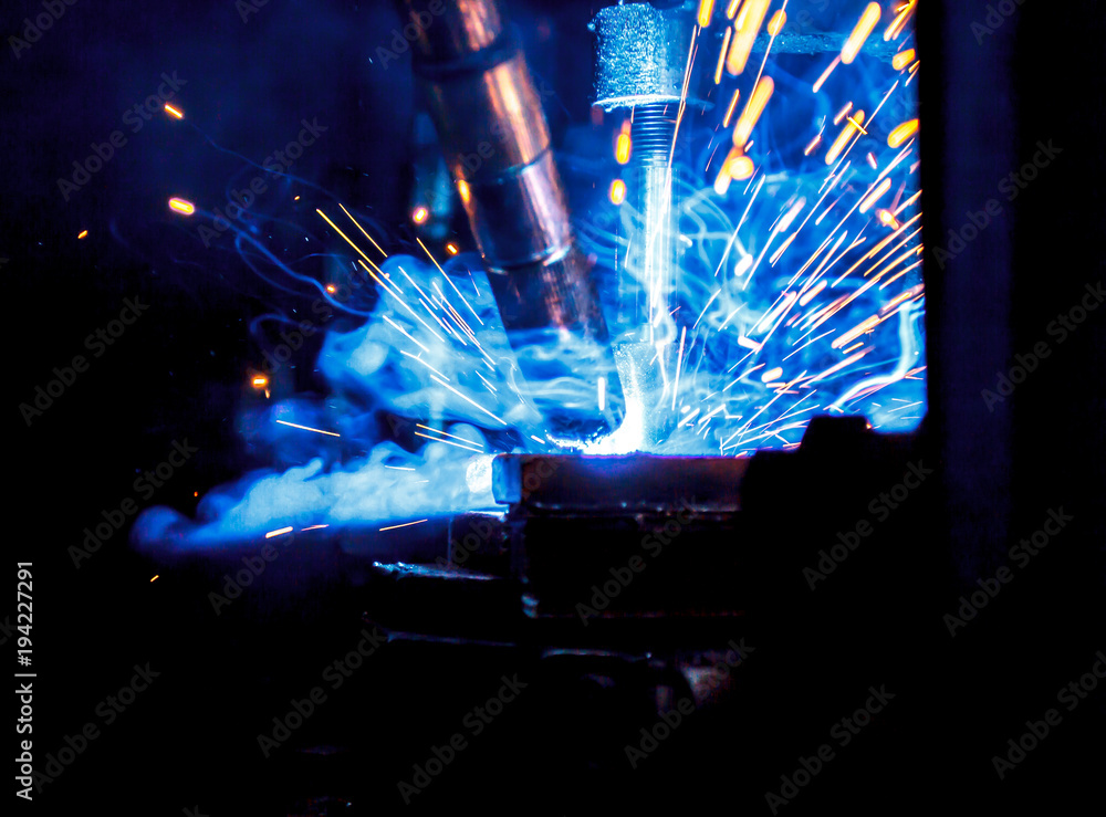 Welding robots movement in a car factory Welding robots movement in a car factory