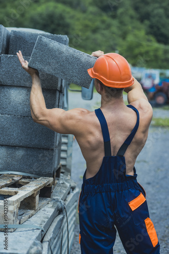 Sexy builder concept. Man or bodybuilder with big muscles.