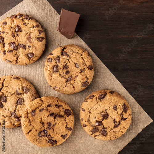 Chocolate chips cookies on baking paper with copyspace, square photo